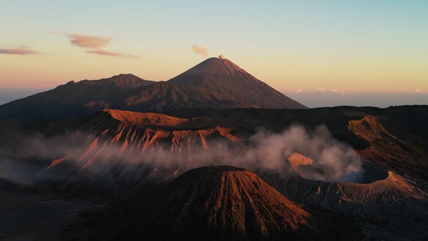 Volcanic eruption at twilight with glowing lava streams flowing down the dark mountainside.