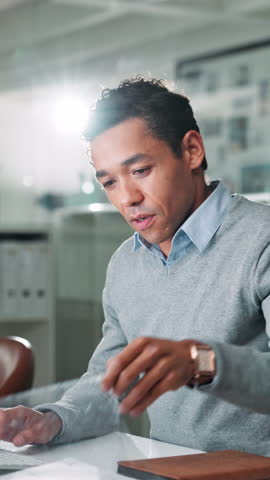 Documents, typing and businessman in office with report for finance dividend, profit or revenue. Technology, paperwork and male financial manager with email for client communication in workplace.