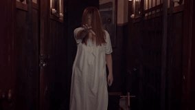 A ghost woman with long hair, white nightie walks along the hall of an old mansion, extends her hand, a frightening hand gesture Cinematic nightmare scene with a monster, paranormal phenomena, phobias - Powered by Shutterstock - Get 15% off with code: PIKWIZARD15