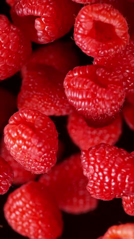 Super Slow Motion Shot of Exploding Fresh Raspberries . Filmed on High Speed Cinematic Camera at 1000fps .