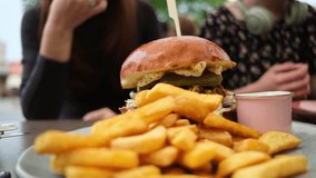 Girl Consuming Fast Food Fries And A Meat Burger In A Cafe - Powered by Shutterstock - Get 15% off with code: PIKWIZARD15