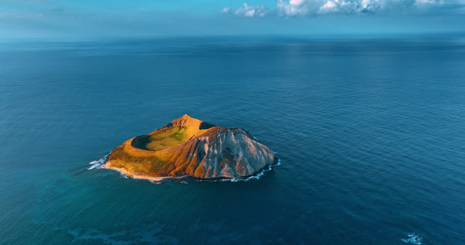 Breath-taking Rabbit Island Oahu, Hawaii, USA. Endless azure waterscape of the Pacific surrounds the rock. Aerial view.