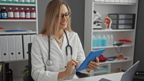 Doctor woman using tablet in hospital clinic office interacting with patients digitally enhancing healthcare communication and efficiency. - Powered by Shutterstock - Get 15% off with code: PIKWIZARD15