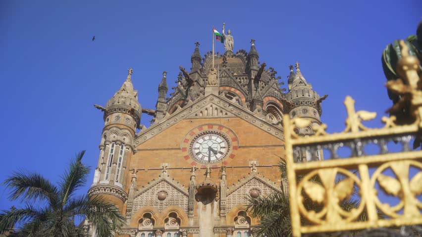 UNESCO Chhatrapati Shivaji Maharaj Terminus railway station, Indian national flag waving at CSMT station, High angle shot