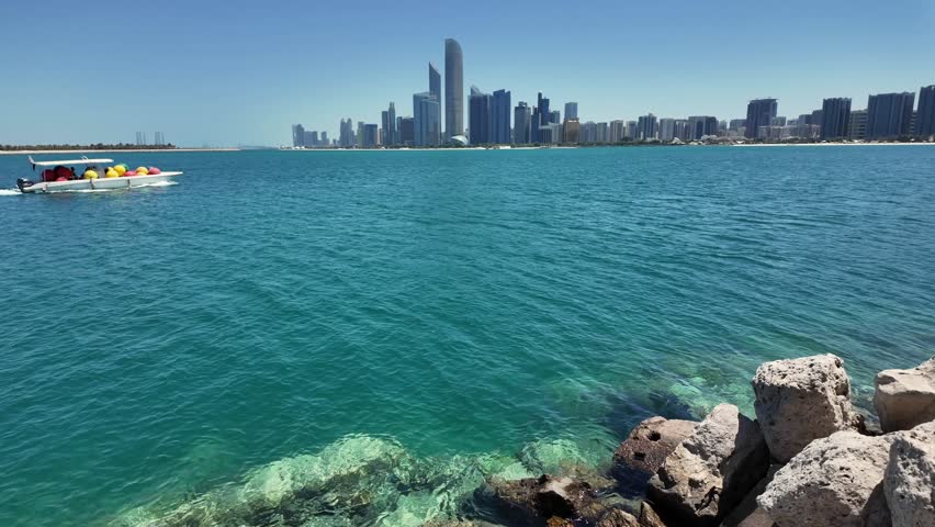A view of the Abu Dhabi skyline on a bright, sunny day in the United Arab Emirates