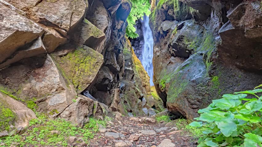 Secluded Waterfall in Rocky Gorge Landscape