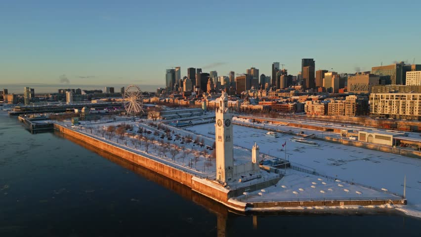 Stunning aerial view of Montreal’s old port with the clock tower and city skyline in winter, North America, Quebec, Montreal, Canada.
