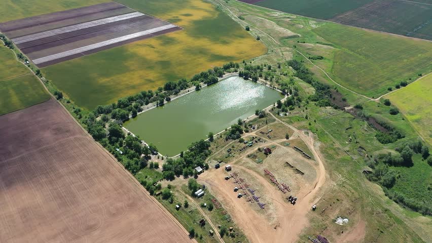 HD. An artificial lake as a source of water for agriculture in the middle of the plantation.