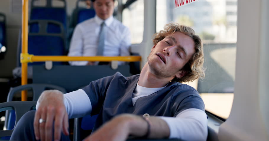 Male nurse, tired and rest with sleeping on bus for shift fatigue, morning commute and overworked. Healthcare, man and exhausted on public transport with burnout, relax and mental health by window