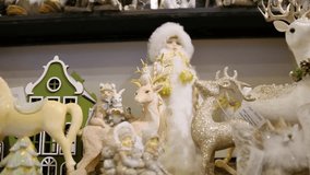 Christmas shelf display with miniature trees and festive figures - Powered by Shutterstock - Get 15% off with code: PIKWIZARD15