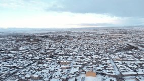 Wide aerial view of Gyumri, Armenia, showcasing the snow-covered cityscape with historic buildings - Powered by Shutterstock - Get 15% off with code: PIKWIZARD15