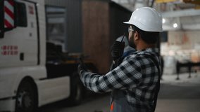 Construction worker coordinating modular home transport logistics - Powered by Shutterstock - Get 15% off with code: PIKWIZARD15