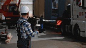 Construction worker coordinating modular home transportation - Powered by Shutterstock - Get 15% off with code: PIKWIZARD15