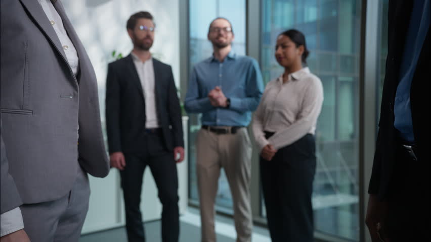 Close up handshake two businesspeople shaking hands background of office multiethnic workers applause businessmen businesswomen team successful business financial deal agreement partners cooperation
