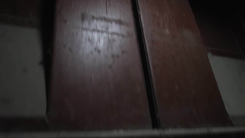 an elevator descent into a dungeon or basement with concrete walls and steel reinforcement. A secret underground facility. A secret agent training camp or underground prison.