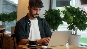 Caucasian man typing laptop desktop computer freelance online distant job work male guy businessman e-commerce client business student cafe restaurant studying entrepreneur visitor indoor order coffee - Powered by Shutterstock - Get 15% off with code: PIKWIZARD15