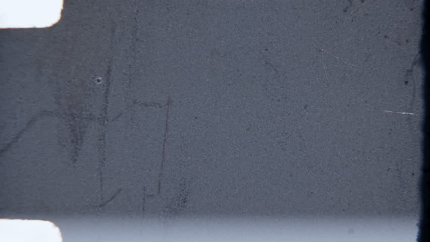 An 8mm film light leak overlay featuring a grainy, textured surface with visible light leaks, scratches, and imperfections typical of aged 8mm film