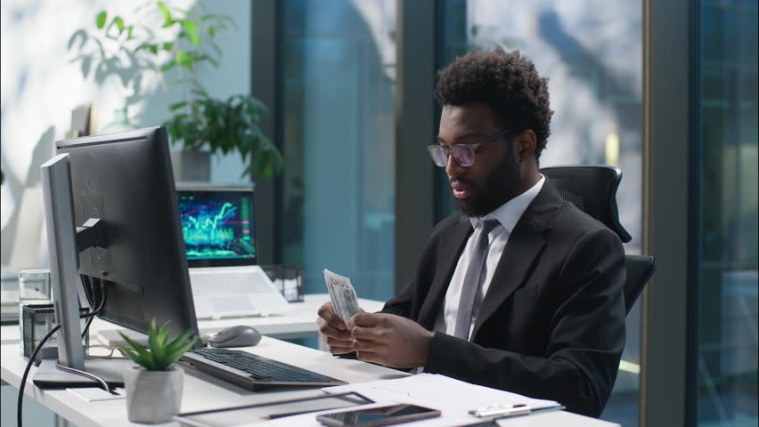 African American businessman counting money banknotes dollars salary problem male sad guy business man employee manager leader financial crisis trouble bankruptcy upset worried entrepreneur in office