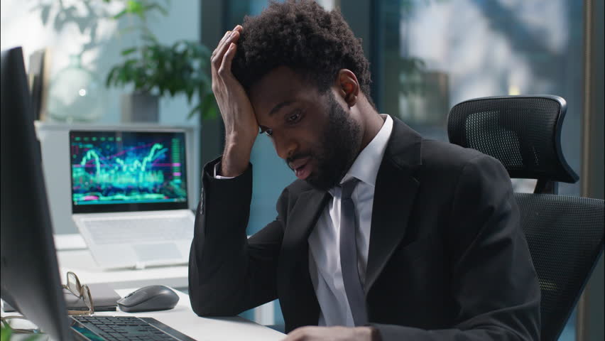 African American businessman counting money banknotes dollars salary problem male sad guy business man employee manager leader financial crisis trouble bankruptcy upset worried entrepreneur in office