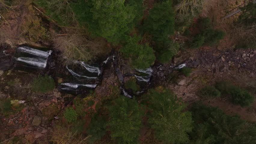 Majestic Tendon waterfall flowing through peaceful forest scene