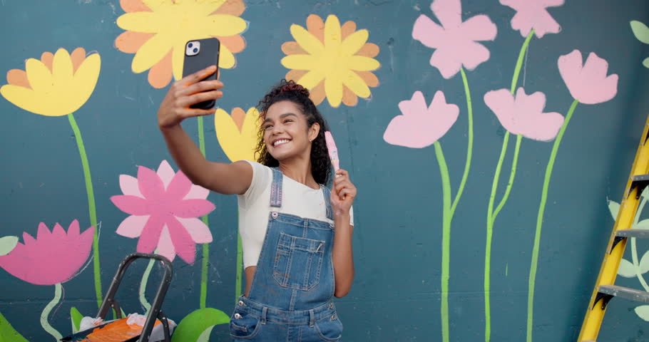 Artist, selfie and woman with smile, painting and photography of wall art for memory and confident. Mural, painter and person with picture for social media, influencer and peace sign for artwork