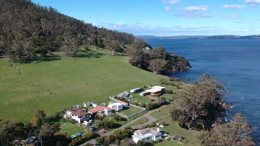 Tinderbox, Tasmania, Australia – Aerial Drone Footage Featuring Clear Waters, Rocky Reefs, Coastal Cliffs, Waterfront Homes, Boat Ramp, Tinderbox Marine Reserve, Bay, and Ocean Views
