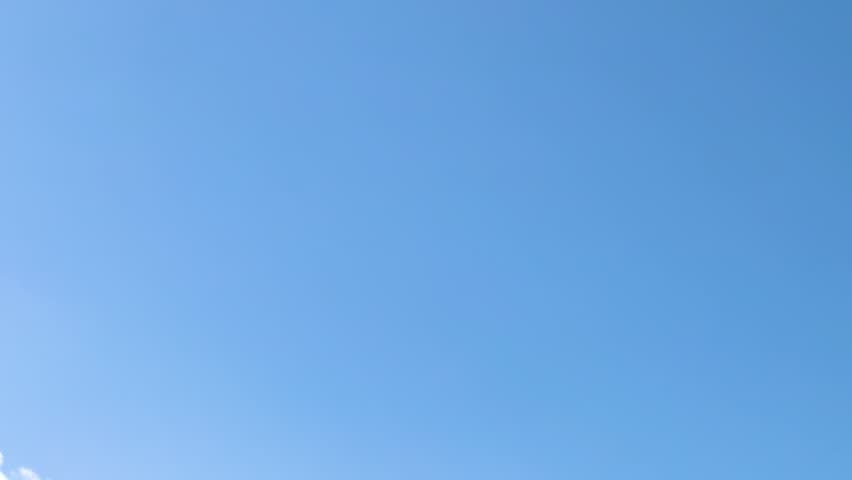 An F-22 Raptor jet performs aerial maneuvers against a clear blue sky during the Avalon Airshow in Geelong, Australia