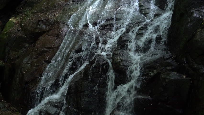 clear stream flows down the rock face in Fukuoka prefecture, JAPAN.