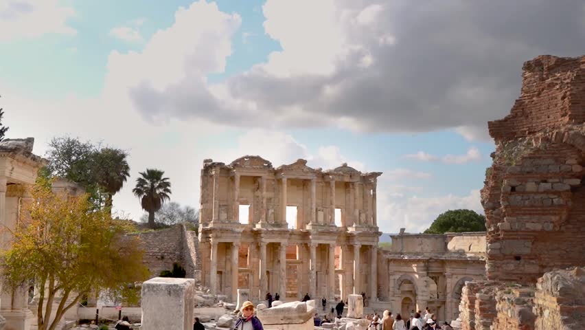 Animated timelapse image of the Library of Celsus, located at the end of the road on Curetes Street in the ancient city of Ephesus, which is on the UNESCO world heritage list, under a slightly cloudy