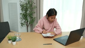 Asian girl diligently studies online and does homework during summer break - Powered by Shutterstock - Get 15% off with code: PIKWIZARD15