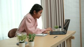 Asian girl diligently studies online and does homework during summer break - Powered by Shutterstock - Get 15% off with code: PIKWIZARD15