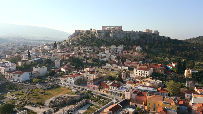 Aerial view of the Acropolis and historic center of Athens, Greece, with ancient ruins, traditional buildings, and scenic urban cityscape