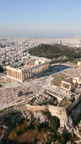 Aerial view of the Parthenon and Acropolis hill in historic center of Athens, Greece, with ancient ruins, panoramic cityscape and historic architecture