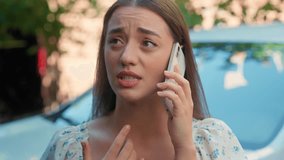 Close up worried stressed Caucasian woman female girl customer rental service client car buyer talking mobile phone speaking smartphone online call explaining problems stress broken automobile at city - Powered by Shutterstock - Get 15% off with code: PIKWIZARD15