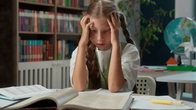Overwhelmed Caucasian little girl worried student child school kid anxious schoolgirl learner pupil holding head indoor classroom lesson looking hard task read book notebook homework education trouble - Powered by Shutterstock - Get 15% off with code: PIKWIZARD15