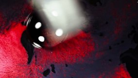 Bright red and black pigments mix in a dramatic macro shot with intense contrast - Powered by Shutterstock - Get 15% off with code: PIKWIZARD15