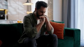 Stressed sick unhappy Caucasian man business male businessman guy homeowner unwell troubled buyer client customer sitting couch covering face with hands stress gesture problems headache pain at home - Powered by Shutterstock - Get 15% off with code: PIKWIZARD15