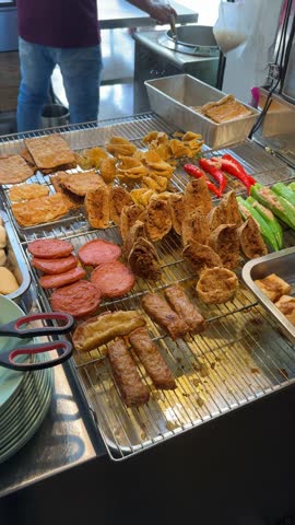 asian food.Yong Tau Foo hakka chinese hawker local food in Malaysia. closeup image of Yong Tau Foo variants, usually served with sweet sauce and made by various fish cake, pork meat and vegetables