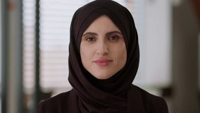 Female portrait indoors Muslim Arabian business woman ethnic girl islamic hijab Islam religion positive face smile businesswoman looking camera beauty fashion health medicine healthcare consultation - Powered by Shutterstock - Get 15% off with code: PIKWIZARD15