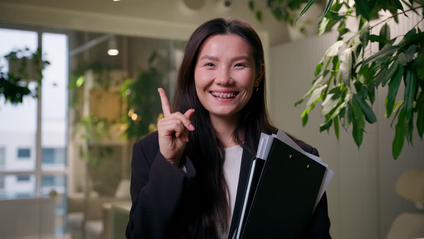 Thoughtful Asian business woman Korean employer thinking pensive office manager Japanese businesswoman student Chinese girl dreaming think ponder happy insight idea plan creative brainstorm indoors