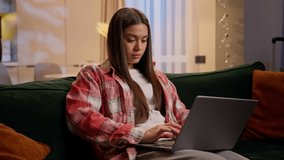 Home studying e-learning using laptop Caucasian teen girl student businesswoman freelancer on couch female woman teenager concentrated working computer online shopping at night home typing pc addict - Powered by Shutterstock - Get 15% off with code: PIKWIZARD15