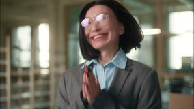 Happy excited cheerful Asian Chinese business woman smiling joyful emotional girl Korean Japanese female businesswoman achievement rejoice dance jump celebrate win clapping hands in office building - Powered by Shutterstock - Get 15% off with code: PIKWIZARD15