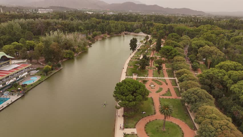4K 60fps drone view tilting down over the lake and Rosedal (Rose Garden) in Parque General San Martin, Mendoza, Argentina