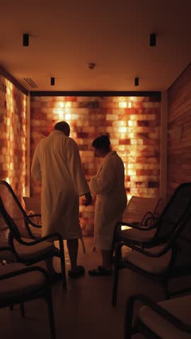 Mature couple in love, sitting and breathing together in luxury salt room in spa center, resort, healthcare, therapy, natural, medical, vacation, holidays, recreation, design, stylish, chill, aging