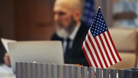 American official working at embassy desk, checking visa documents and forms - Powered by Shutterstock - Get 15% off with code: PIKWIZARD15