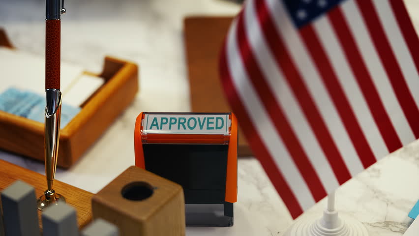 Close-up of approved stamp at American customs office, granting entry permission