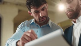 Caucasian men business partners discuss documents in office consultation male guys employees businessmen planning deal two colleagues coworkers job talking bank insurance contract corporate paperwork - Powered by Shutterstock - Get 15% off with code: PIKWIZARD15