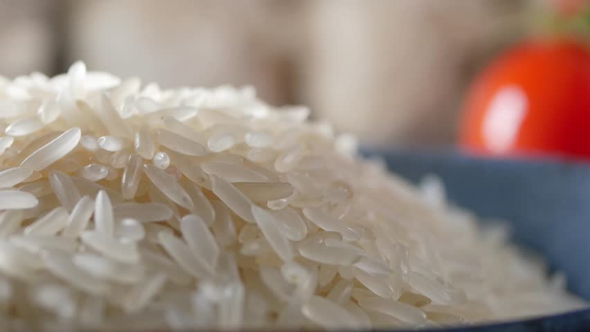 Rice preparation at a home kitchen in the afternoon light