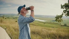 Clean Hydration, Medical Wellness, Active Aging. Senior Man Drinks Fresh Water Surrounded by Beautiful Nature. A Simple Moment of Health, Vitality, and Access to Clean Natural Hydration - Powered by Shutterstock - Get 15% off with code: PIKWIZARD15