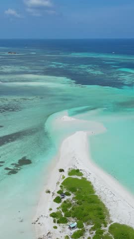 Aerial view of white sandy sandbar near Thulusdhoo island.Maldives.Drone point of view footage.Stunning tropical landscape of Indian Ocean coastline.